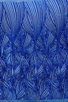 an intricate blue design is on the side of a glass case that has been made to look like waves