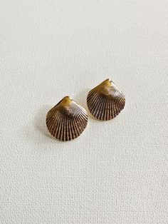 Beautifully detailed, gold plated cockle shell studs. Pairs perfectly with our tiny gold plated studs. DETAILS: 1” Gold Plated Shells Gold Shell With Matching Earrings Gift, Elegant Handmade Gold Shell, Gold Shell With Matching Earrings, Vintage Gold Shell Jewelry, Vintage Gold Shell As A Gift, Vintage Gold Shell As Gift, Gold Brass Shell Earrings, Bohemian Gold Shell-shaped Jewelry, Venus Shell