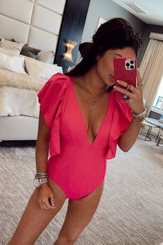 You are definitely goin got be seen in this stunning one piece! It has the perfect combination of sass and class! The deep v-neck provides the perfect amount of sass while those adorable ruffled sleeves give off all the feminine class you could want! This one piece swimsuit features a deep v-neck, ruffled sleeve detailing, removable padding, full lining, and nice coverage. Coverup Swimsuit, Spring Break Outfit, Trendy Swimwear, Pink Ruffle, One Piece Suit, Ruffled Sleeves, Fuchsia Pink, Sleeve Detail, The Deep