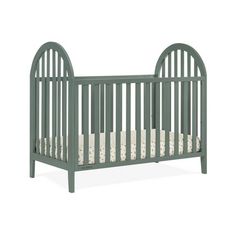 a baby crib with a mattress in the bottom half and side rails on each end