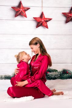 Christmas Matching Pajamas Family Of 3, Family Christmas Pictures In Silk Pajamas, Satin Pajama Christmas Picture, First Christmas As Family Of 4, First Christmas Family Pajamas, Matching Christmas Pajamas Black And Gold, Family Christmas Pitures, Matching Red Christmas Pajamas Family, Red Silk Christmas Pajamas