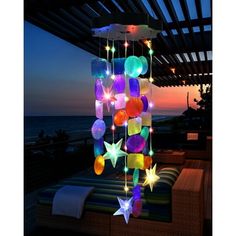 a multicolored mobile with stars hanging from it