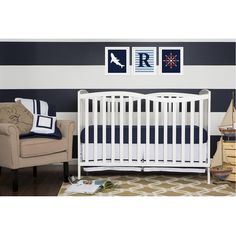 a baby's room with black and white striped walls