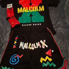 Malcolm X Shirt Colors: Black Size: Large Retail: $38 Malcolm X Shorts Color: Black Size: Large Retail: $50 Malcolm X Socks Color: Red Size: 6-12 Retail: $10 ((Brand New)) Casual Multicolor Short Sets, Casual Red Sets For Streetwear, Multicolor Graphic Print Sets For Streetwear, Casual Fitted Shorts With Graphic Print, Fitted Casual Shorts With Graphic Print, Fitted Casual Shorts For Streetwear, Sporty Black Short Sets, Casual Red Shorts With Graphic Print, Sporty Streetwear Sets With Graphic Print