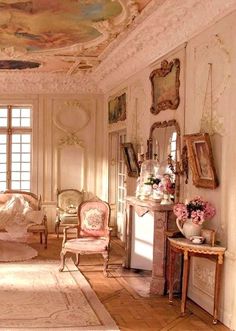 an image of a room with paintings on the ceiling and furniture in it, as well as pictures