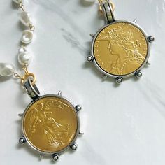 If you're looking for a Spectacular Statement Necklace, look no further….🌟 Large reproduction French coin in matte gold set in decorative silver bezel. We've done a few variations of this design, it's been one of our best sellers. This beauty hangs from a gold beaded vintage style glass pearl chain with lobster clasp which can be adjusted to wear up to 20” in length. Need it longer? Just choose your length from our drop down menu! Chain and clasp are brass based with gold electroplate and a pro French Coins, Lady Liberty, Custom Jewelry Design, Pearl Chain, Champagne Gold, Gold Set, Matte Gold, Gold Beads, Custom Jewelry