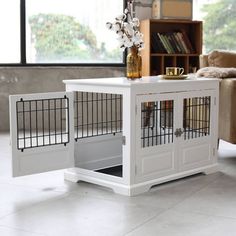 a white dog crate with its doors open