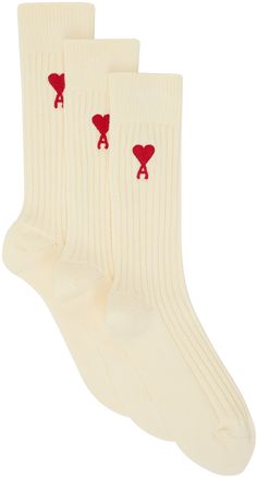 Pack of three pairs of calf-high rib knit stretch cotton-blend socks in off-white. Logo embroidered at cuffs. Supplier color: Off white Paris Clothing, Company Swag, Socks Aesthetic, Embroidered Socks, Ami Alexandre Mattiussi, Alexandre Mattiussi, Sock Packs, White Socks, Ami Paris