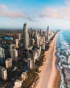 an aerial view of the gold coast with high rise buildings and beach in foreground