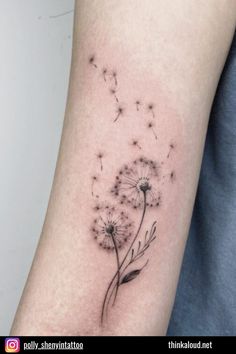 a small dandelion tattoo on the arm