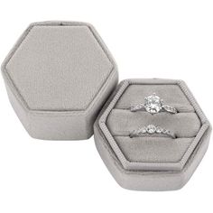 two engagement rings in a velvet ring box