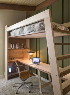 there is a bunk bed with a desk and chair in the room next to it