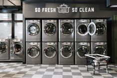 several washers and dryers are lined up in front of a sign that says so fresh, so clean