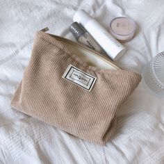 Beige Portable Cosmetic Bag For School, Portable Beige Cosmetic Bag For School, Portable Beige Pouch For Daily Use, Beige Corduroy Rectangular Bag, Rectangular Beige Corduroy Bag, Portable Beige Pouch Cosmetic Bag, Beige Portable Cosmetic Bag For Everyday Use, Daily Use Beige Pouch With Zipper Pocket, Everyday Portable Beige Cosmetic Bag