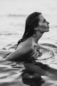 a woman is swimming in the water