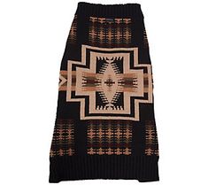 a black skirt with brown and tan designs on it's side, in front of a white background