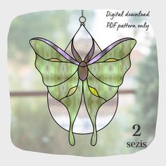 a stained glass butterfly hanging on a window sill with the words, digital artwork only