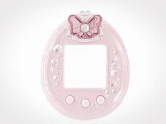 a pink light switch cover with a butterfly on it's face and pearls around the edges