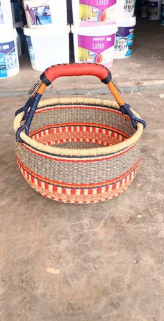 an empty basket sitting on the ground