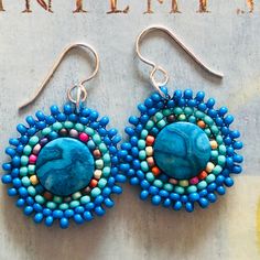 Small Beaded Dainty Blue Jasper Earrings, Handmade Boho Dangle Drop Earrings,  Small seed bead disk earrings made with bright blue enhanced Jasper beads and mullticolored  seed beads. Each tiny bead is individually hand sewn and expertly woven to make these beautiful earrings. The  ear wires and findings are 14kt gold plated.  These small disc earrings measure approximately 2 inches including the ear wires. The Jasper gemstones are 1.25 inches.  Lightweight and fun to wear. Perfect gift for a lo Bohemian Wedding Earrings, Disk Earrings, Earrings Handmade Boho, Blue Beaded Earrings, Blue Jasper, Silver Statement Earrings, Jasper Earrings, Beaded Earrings Patterns, Disc Earrings