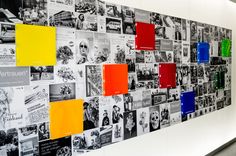 a wall with many different colored squares on it