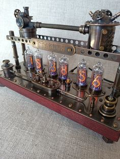 an old fashioned machine with many tubes and knobs