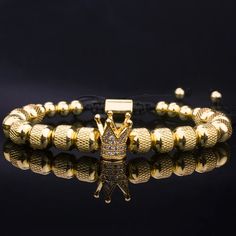 The Empowerment Crown bracelet gift set is a powerful and elegant reminder to stay strong and confident. This stunning crafted bracelet features a crown motif, symbolizing resilience and self-assurance. Specifications: Material: Made from high-quality stainless steel with a gold finish, ensuring durability and a sophisticated look. Design: Features an intricately detailed crown charm surrounded by textured beads, creating a striking visual appeal. Inspiration: Accompanied by a card with the motivational message "Straighten Your Crown," serving as a daily reminder of inner strength. Size: Adjustable to fit various wrist-sizes comfortably, ensuring a perfect fit for everyone. Occasion: Ideal for gifting on birthdays, graduations, or as a thoughtful gesture to encourage and inspire someone. T Straighten Your Crown, Crown Bracelet, Crown Charm, Engraved Earrings, Medical Jewelry, Rings Jewelry Fashion, Engraved Bracelet, Moonstone Jewelry, Ring Pendant Necklace