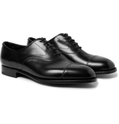 One of Edward Green 's most popular styles, these 'Chelsea' Oxford shoes have been meticulously handcrafted in England from smooth burnished-leather that will further soften and gain a patina over time. They have a softly curved '202' last that accommodates wider feet, and are set on soles that have been tanned for nine months to enhance flexibility. Shown here with John Smedley rollneck, Boglioli suit, Dunhill briefcase. Classic Cap Toe Oxfords For Galas, Classic Leather Shoes With Branded Insole And Cap Toe, Classic Leather Cap Toe Shoes With Rubber Heel Cap, Timeless Cap Toe Leather Shoes For Galas, Cap Toe Dress Shoes With Rubber Heel For Galas, Classic Cap Toe Dress Shoes For Galas, Classic Leather Shoes With Goodyear Welt For Galas, Classic Goodyear Welted Leather Shoes For Galas, Classic Cap Toe Bridle Leather Shoes