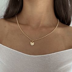 Our Valentina Heart Necklace is the sweetest statement necklace. Layer with other necklaces to elevate your look! Product Details: 14k Gold Filled Large Ball Chain Gold Filled Puffy Heart Charm 16" & 18" in Length Made in USA Gold Heart Pendant Necklace, Expensive Necklaces, Puffy Heart Necklace, Puffy Heart Charms, Pandora Necklace, Heart Pendant Gold, Puffed Heart, Girly Accessories, Gold Heart Necklace