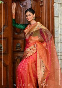 Nicknamed 'woven air' and handmade with fine yarns, this Chanderi silk saree is a sheer delight! Look at the intricately woven curvilinear borders that are decorated with a tingle of Meenakari green resham! The glow from this saree dual tone mustard pink saree is sure to spark your inner happiness! The saree is ready to wear with falls and pico done. An unstitched blouse fabric is included. *Note: There may be minor variations in the shade, the texture of the product. Hues/textures show differen Red Anarkali Dress, Indian Dresses Anarkali, Pink Shot, Inner Happiness, Beautiful Chokers, Silk Saree Blouse, Natural Silk