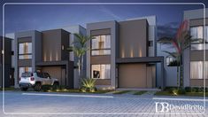 a car is parked in front of some very modern looking homes at night time with palm trees