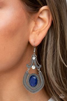 Studded silver detail and dainty silver bars fan out from an oversized blue gem at the bottom of a white rhinestone dotted frame, resulting in an ornate lure. Earring attaches to a standard fishhook fitting.

 Sold as one pair of earrings. Purple Gems, Mixed Metal Jewelry, Purple Earrings, Paparazzi Accessories, Blue Gems, White Rhinestone, Silver Bars, Paparazzi Jewelry, Online Earrings