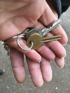 a person holding several keys in their hand