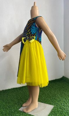 This colorful Princess dress has been made with all the care and love your little one deserves It is custom made to fit perfectly on your little one. It can be requested in other Ankara print of choice. It can be made with extra fullness It is made with 100% cotton Ankara fabric and luxurious tulle Simply start a conversation with me and I will be glad to be of service  Inner soft lining Back zipper sleeveless Fitted Tulle Sleeveless Dress For Dress-up, Fitted Tulle Princess Sleeveless Dress, Playful Fitted Tulle Dress, Cotton Princess Party Dress, Playful Tulle Dresses For Party, Fitted Multicolor Tutu Dress With Tulle Skirt, Multicolor Tulle Skirt Dresses For Party, Fitted Yellow Dress For Dress-up, Fitted Multicolor Tulle Princess Dress