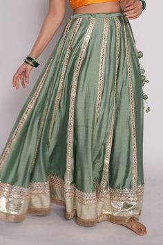 Sea green lehenga in chanderi base with embroidered gota borders.
Component: 1
Pattern: Embroidered
Type Of Work: Gota Work
Fabric: Chanderi
Color: Green
Other Details: 
Attached lining
Gota borders
Fringed hem
Note: The blouse and dupatta worn by the model is not for sale
Occasion: Destination Wedding - Aza Fashions Sea Green Lehenga, Lehenga Skirts, Lehenga Green, Lehenga For Women, Skirts Green, Work Lehenga, Green Lehenga, Gota Work, Lehenga Online