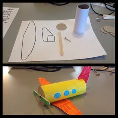 an airplane made out of toilet paper on top of a table next to a roll of tape