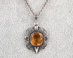 Beautiful Arts and crafts silver and citrine pendant in excellent condition complete with the original chain fitted with a T-bar clasp typical of the period, circa 1910.  This has been left in its original uncleaned condition and has very nice patination. Pendant measures 3.5cm (1.5 ins) from the top of the bale. Chain measures 40.5 cm (16 ins). The pendant and chain are unmarked but test as silver. I am happy to ship worldwide and happy to combine shipping/postage. Please email if you have any Antique Silver Citrine Jewelry, Citrine Pendant, Citrine, Beautiful Art, Etsy Gifts, Necklace Lengths, Jewelry Necklace Pendant, Jewelry Necklaces, Arts And Crafts