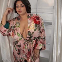 Experience the Beauty of the Peach Garden Floral robe The Peach Garden floral robe combines soft peach tones with vibrant floral prints for an elegant touch. Perfect for lounging or unwinding, this floral robe offers a luxurious feel with effortless style. Elegant long sleeve, long robe, kimono with invisible side seam pockets. Exclusive QWR pattern features a soft peach hue with oversized bold floral peony patterns in red, yellow and green florals for a fresh, garden-inspired look. Prominent co Feminine Floral Print Robe For Loungewear, Pink Floral Print Kimono For Loungewear, Pink Floral Print Open Front Kimono, Floral Print Kimono Sleeves Sleep Robe, Feminine Open Front Robe For Loungewear, Pink V-neck Spring Robe, Pink Spring Robe For Relaxation, Floral Print Sleepwear With Kimono Sleeves, Pink Robe For Spring Relaxation