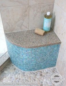 a bottle of soap sitting on top of a bathtub next to a tile wall