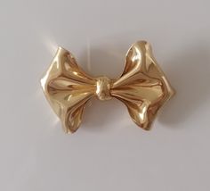 "Magnificent vintage CHRISTIAN DIOR bow in gold metal Signed on plate :     Ch Dior - Germany 8cm X 5.5cm   3.9\" X 2\" In excellent vintage condition" Vintage Gold-tone Brooches For Formal Occasions, Gold Bow Brooches For Formal Occasions, Formal Gold Brooch With Bow, Vintage Bow Brooch For Formal Occasions, Vintage Formal Brooch With Bow, Vintage Yellow Gold Brooches For Party, Gold Brooch Pins For Party, Gold Bow Brooch For Party, Gold Brooch With Decorative Bow For Party