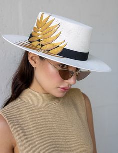 Introducing our brand new Cordobes style hat, our palmita design is reimagined in an elevated and elegant way. Perfect for the fashion-forward, ultra chic girl who's ready to make a statement. ELASTIC: Our hats feature an internal elastic band for a comfortable fit and are designed with intricate detailing on the underside of the brim for added style.Hours of Work: 6hrs. How to Find Your TD Hat Size Finding your perfect hat size requires you to measure your head properly. All you need is a cloth Designer Curved Brim Hat For Vacation, Designer Summer Hats With Short Brim, Designer Summer Hat With Short Brim, Designer Short Brim Summer Hat, Luxury Boater Hat With Flat Brim, Designer White Hats For Spring, Designer White Spring Hat, Luxury White Beach Hat, Chic Adjustable Boater Hat With Structured Crown