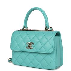 This Mini Trendy CC bag is in Turquoise lambskin leather with light gold tone hardware and has a front flap with signature CC turnlock closure, rear half moon pocket, single interwoven Turquoise leather and light gold tone chain link shoulder/crossbody strap and top handle.The interior is lined in Turquoise leather and features two compartments and a zipper pocket with Chanel pull.Collection: 24COrigin: ItalyCondition: New and never wornAccompanied by: Chanel box, Chanel dustbag, felt, ribbon, a Chanel Box, Chanel Mini, Swag Bag, Turquoise Leather, 1940s Dresses, Conversion Chart, Top Shelf, Chanel Bags, Tiffany Blue