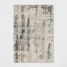 an abstract rug in grey and white tones