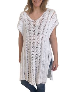 Hand-knit in a lightweight, cotton blended yarn, The Layla Kaftan is an easy summer staple. The lace stitch adds texture and is a unique feature of this timeless warm-weather classic. From sitting on the beach in your favorite swimwear, to a stroll into town paired with your favorite summer pants, this knit will be a no-brainer all season long. Each Ready Made Third Piece is individually hand-knit through our team of knitters based Boston, Massachusetts and produced in small batches. PRODUCT DET Spring Knit Cover-up For Warm Weather, Casual White Cover-up With Crochet Trim, Spring White Knit Cover-up, White Cotton Cover-up For Warm Weather, Bohemian V-neck Knit Top For Beach, Summer V-neck Knit Top For Beach, Spring Open Knit Cover-up, Summer Open Knit Top For Layering, Stretch Open Knit Cover-up For Spring