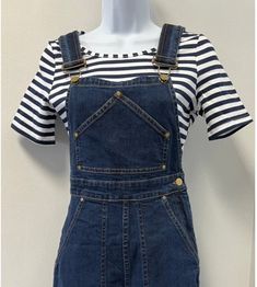 This top from Star Struck is so versatile! A great staple piece for all seasons, the comfy top has short sleeves and a round neckline. Pair it with high waisted jeans or their classic overalls for a perfect vintage inspired outfit!Fabric: 95% cotton, 5% elastaneThis is a special order item and will take 5-7 days to ship.Size: SBust: 34"Waist: 28"Size: MBust: 36"Waist: 30"Size: LBust: 38"Waist: 32"Size: XLBust: 40"Waist: 34"Size: 2XBust: 42"Waist: 36"Size: 3XBust: 44"Waist: 38" Trendy Relaxed Fit Short Sleeve Overalls, Trendy Cotton Overalls With Short Sleeves, Short Sleeve Dark Wash Overalls For Spring, Casual Relaxed Fit Shortalls For Fall, Casual Short Sleeve Overalls For Workwear, Casual Workwear Overalls With Short Sleeves, Casual Overalls For Workwear, Casual Shortalls For Workwear In Fall, Casual Dark Wash Shortalls For Work