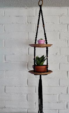 three tiered hanging planter with succulents and beads