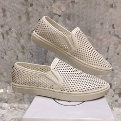 Perforated, Slip On Sneakers Original Shoe Box Included New Spring Leather Slip-on Sneakers With Perforations, Slip-on Sneakers With Perforations, Slip-on Sneakers With Perforations And Flat Heel, White Slip-ons With Perforations, White Perforated Slip-on Shoes, White Perforated Slip-ons, Summer Slip-on Sneakers With Vented Sides, White Perforated Round Toe Slip-ons, Perforated Low-top Slip-ons