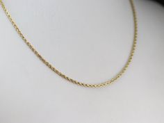 This twisted rope chain has subtly faceted links that make it sparkle in the light! Crafted of yellow gold, this necklace features a safety clasp that keeps it secure around your neck. This lovely chain is ready to be strung with the pendant of your choice! Metal: 14K Yellow Gold Width of Chain: 2.1 mm Length of Chain: 16 Inches Marks: "14K" Stamped on the clasp Affordable Gold Rope Chain Necklace, Cheap Metal Rope Chain Necklaces, Cheap Metal Rope Chain Necklace, Rope Chain Gold, Chain Gold Necklace, Gold Rope Chains, Rope Chain Necklace, Necklace Layering, Cameo Ring