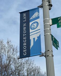 a street sign is attached to a pole