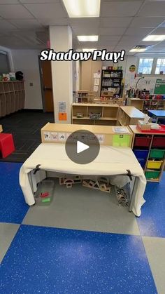 the inside of a classroom with blue flooring